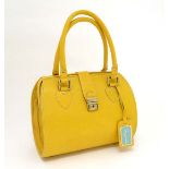 A Genuine Ladies Tom Joule yellow leather barrel bag, with blue enamel tag. Blue flowered cotton