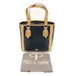 A Genuine Ladies  Pied a Terre leather handbag in navy colour with bone coloured handles, with