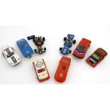 A collection of 6 Scalextric slot cars to include a white Esso Metro L6104, a black Navico Metro