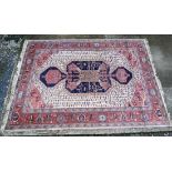 Rug / Carpet :  a large mid 20 thC machine made carpet with salmon pink and fawn ground, large