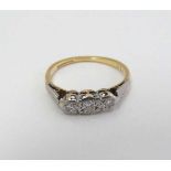 An 18ct gold ring set with three platinum set diamonds  CONDITION: Please Note -  we do not make