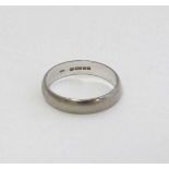 An 18ct white gold wedding band  CONDITION: Please Note -  we do not make reference to the condition