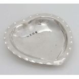 A silver heart shaped bon bon dish hallmarked Birmingham 1907 maker A & J Zimmerman Ltd. 4" x 3 1/2"