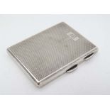 An Art Deco silver cigarette case with engine turned decoration Birmingham 1933 maker The Northern