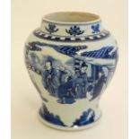 A Chinese blue and white baluster vase decorated with images of figures in an interior scene to