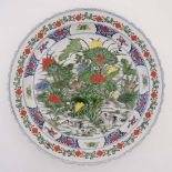 A Chinese famille verte charger, having hand painted floral and foliate decoration. 17 3/4''