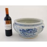 Large Chinese blue and white bowl decorated with Chinese script and landscape cartouches, bears