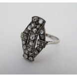 An 18ct white gold Arty Deco style ring set with a  profusion of diamonds CONDITION: Please