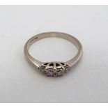 An 18ct white gold ring set with 4 diamonds to top  CONDITION: Please Note -  we do not make