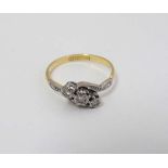 An 18ct gold ring set with three graduated diamonds in a platinum setting CONDITION: Please