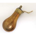 Militaria : A pistol powder flask , the copper reservoir terminating in brass banding and a sprung