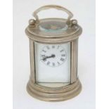 Miniature White metal cylindrical carriage clock :  a white metal and bevelled 5 glass cylindrical