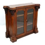 A Victorian oak glazed 2-door bookcase with columns to sides. the whole 51" wide x 19" deep x 44 3/