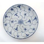 A 19thC hand painted Chinese blue and white ' Lotus '' Tek Sing style plate decorated with