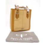 A Genuine Ladies Pied a Terre leather handbag in bone colour, with striped lining and three inside