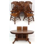 A late 20thC American style twin pedestal extending oak D-ended dining table having 2+6 chairs ( the