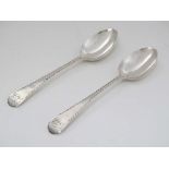 A pair of Geo III silver of Old English feather edge table spoons Hallmarked London 1782 maker