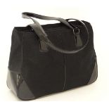 A Genuine Ladies DKNY black weekend bag. Approx 11'' high x 16'' deep x 5'' wide (excluding