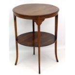 An Edwardian two tier occasional table of circular form with cross banding and stringing 21 1/4"