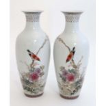 A pair of small Chinese Republic famille rose vases, decorated with birds on flowering boughs of