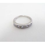 A silver ring set with chip set diamonds and pale purple stones  CONDITION: Please Note -  we do not