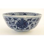 A blue and white Chinese '' lotus '' bowl, the exterior decorated with lotus flowers amongst