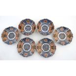 A set of four Japanese plates  together with two matching bowls , in Imari colours decorated with