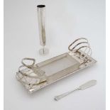 A unusual silver plate toast rack with central glass butter dish together with a silver Albany