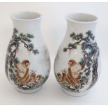 A pair of Chinese republic famille rose vases decorated with Monkeys and gnarled pine trees on a