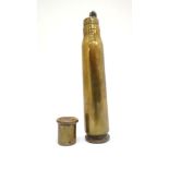 Militaria : A Trenchart .50 calibre cannon shell converted into a table lighter . The cap