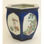 A large early 20thC Chinese republic famille rose planter / jardiniere, the sides of the hexagonal-