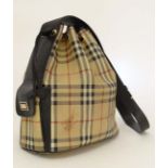 A Genuine Ladies  Burberry London, Nova Check duffel handbag, inside pocket with zip and  black