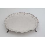 A silver salver with wavy edge on four feet. Hallmarked Sheffield 1964 maker Poston Products Ltd 12"