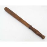 Militaria : a turned hardwood Police truncheon, stamped ' D 1269 ' above the grip , 18 4/8" long