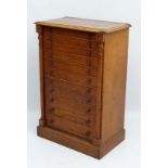 A mid 19thC golden oak Wellington Chest / collectors cabinet comprising 11 graduated drawers.  36