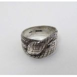 A hallmarked silver ring formed as entwined snakes. Hallmarked London 1977 maker AJL d