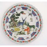 A Chinese famille verte charger, having hand painted of  deer and a crane . 17 3/4'' diameter.