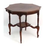 A Victorian walnut occasional table with serpentine shaped sides, four legs and undertier. 28 1/2"