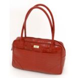 A Genuine Ladies  Osprey red mock crocodile handbag, with two handles and zip closure, Two outside