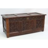 A 17thC oak 3 panel coffer with peg joints, carved lunettes and panels to front supports and side