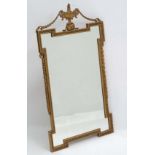 A mid 20thC Adams style Kent shaped  gilt wall mirror by Atsonea , 24" wide x 14 1/2" high