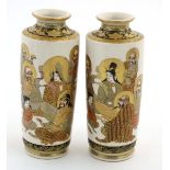 A pair of Japanese Satsuma vases, decorated with seated figures, bearing makers marks to bases. 6