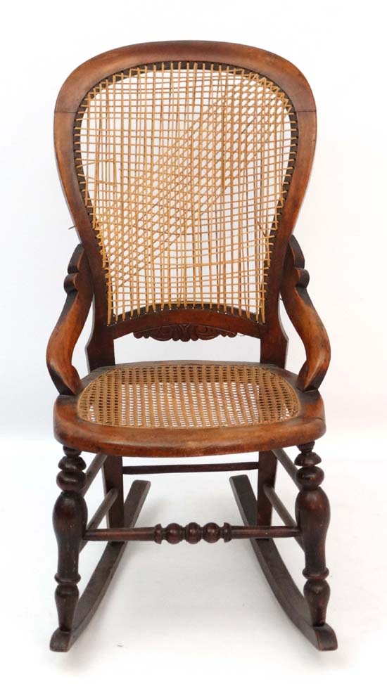 A c.1860 Victorian stained walnut rocking chair with caned seat and back and quantity of restorers - Image 5 of 5