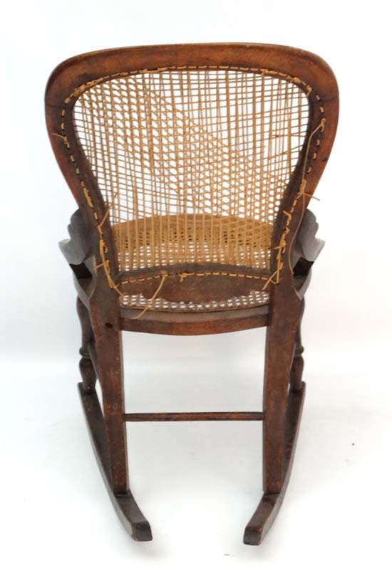 A c.1860 Victorian stained walnut rocking chair with caned seat and back and quantity of restorers - Image 2 of 5