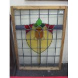 A RECTANGULAR COLOURED AND LEADED LIGHT WINDOW, 39" x 26.5", in a retaining frame