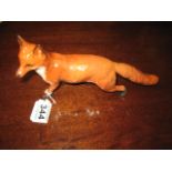 A MODEL of a Fox standing, 9" long, 5.5" high, Beswick