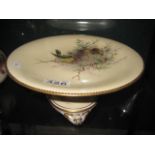 A PORCELAIN TAZZA with hand painted firecrest and overlaid gilt decoration, 9.25" diameter
