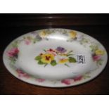 A LARGE OVAL PLATE with hand painted floral decoration, 10.5" x 8", Royal Worcester
