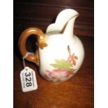 A PORCELAIN JUG of blush ivory ground with hand painted floral decoration, Rd no. 29115, 5.75",