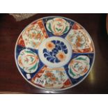 A POTTERY WALL PLAQUE in typical Imari palette, 12.5", Japanese